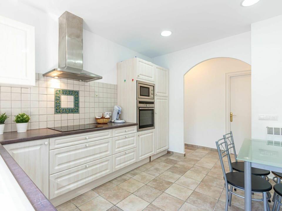 Cabinetry, Furniture, Property, Countertop, Wood, Lighting, Interior Design, Kitchen, Chair, Flooring