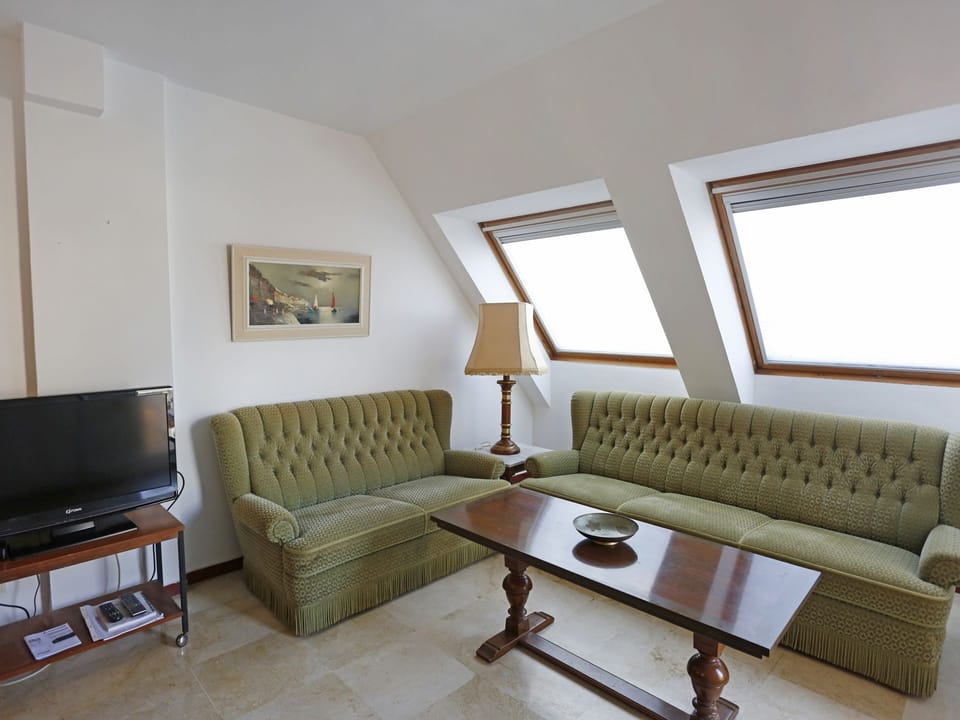 Furniture, Room, Property, Living Room, Interior Design, Couch, Floor, Table, Building, Wall