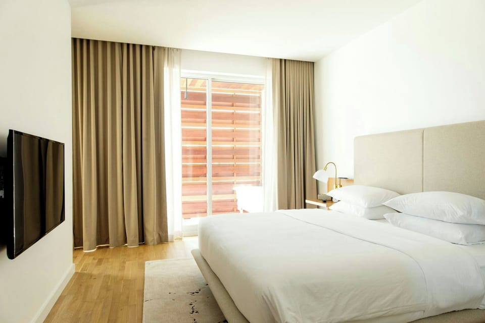 Premium bedding, down comforters, pillowtop beds, minibar