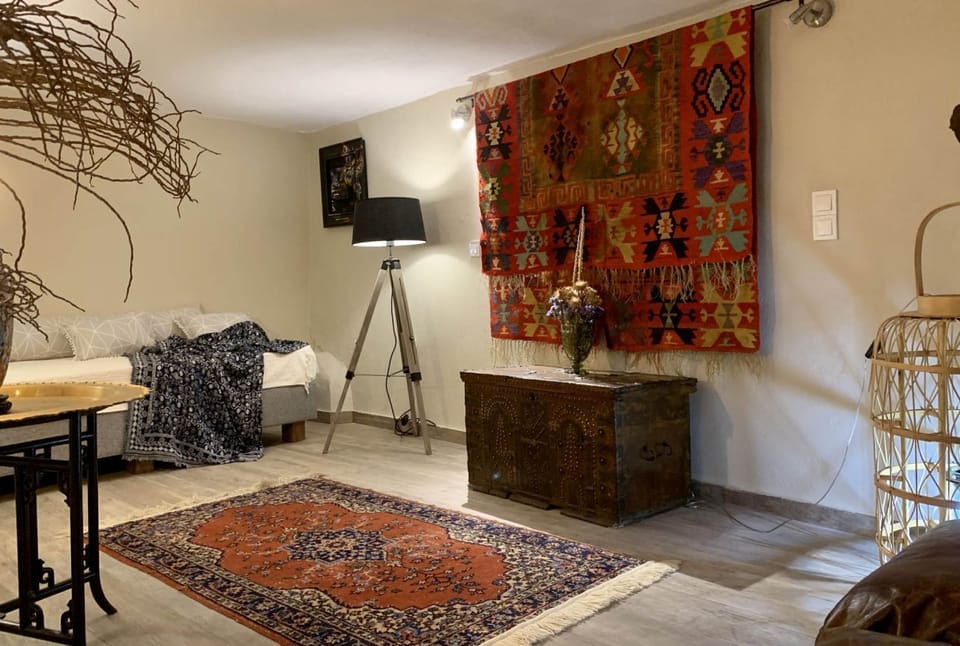 Luxury Suite | Living area | 55-inch LCD TV with premium channels, TV, Netflix