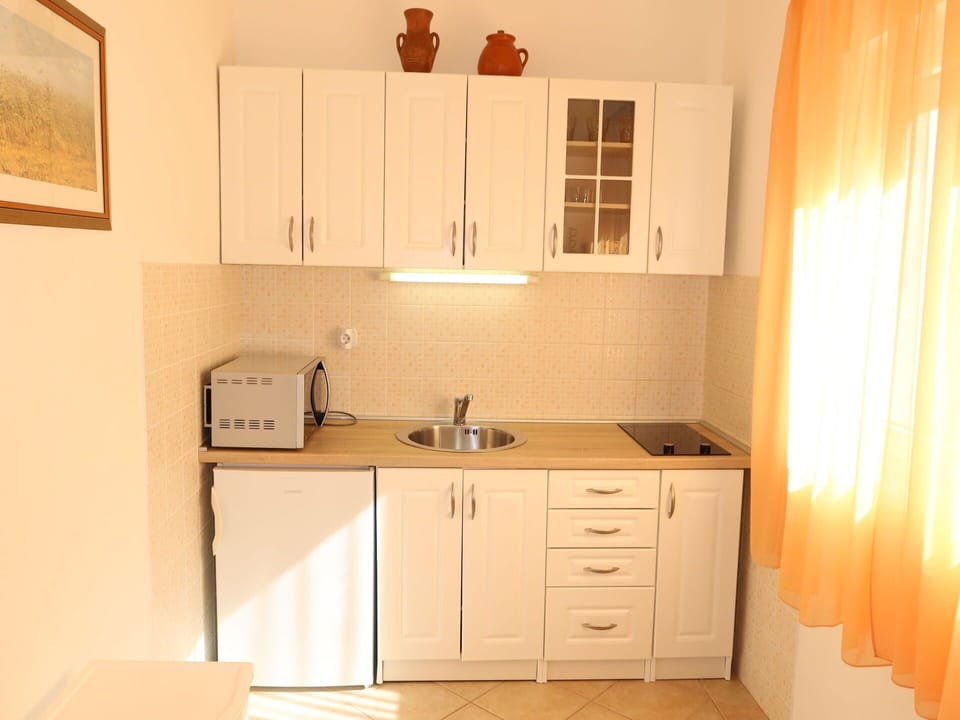 Cabinetry, Property, Countertop, Furniture, Sink, Kitchen Sink, Window, Wood, Building, Curtain