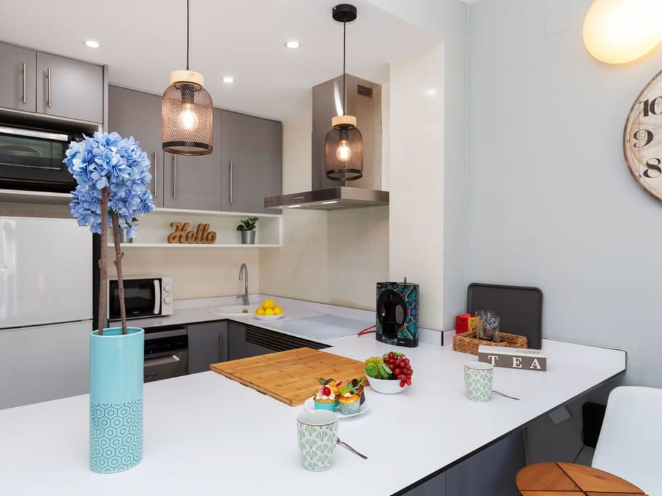 Table, Furniture, Property, Orange, Interior Design, Countertop, Clock, Living Room, Cabinetry, Kitchen