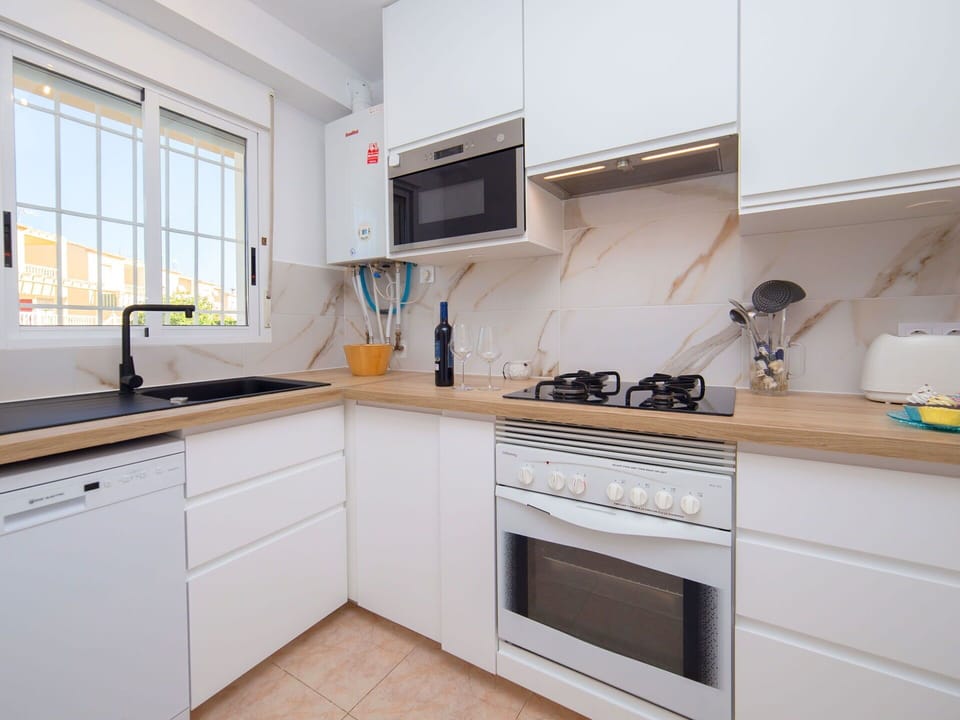 Countertop, Cabinetry, Property, Sink, Window, Kitchen Sink, Tap, Kitchen Stove, Kitchen, Wood