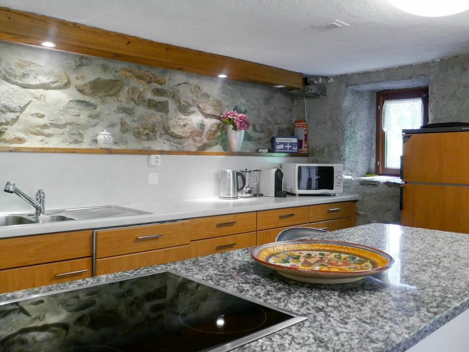Countertop, Property, Room, Kitchen, Cabinetry, Interior Design, Furniture, Yellow, Tile, Sink