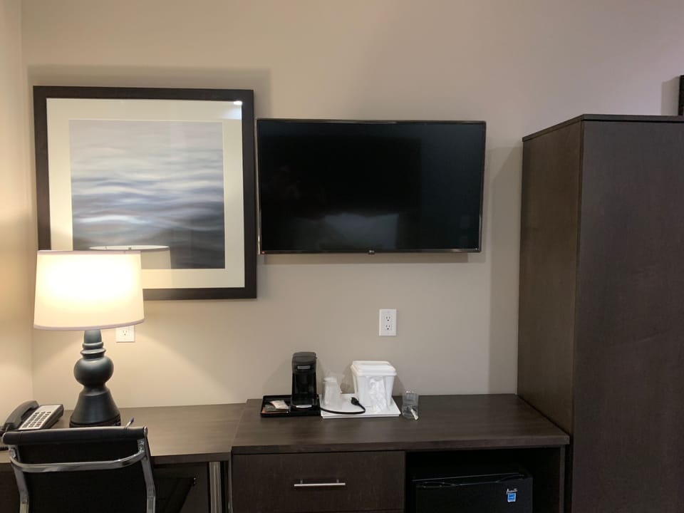 Desk, laptop workspace, blackout drapes, iron/ironing board