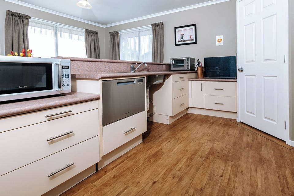 Kitchen, includes microwave, on-bench oven, 2 hob induction cooktop, dishdrawer