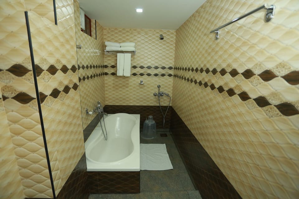 Grand Double Room, City View | Bathroom | Shower, jetted tub, rainfall showerhead, free toiletries