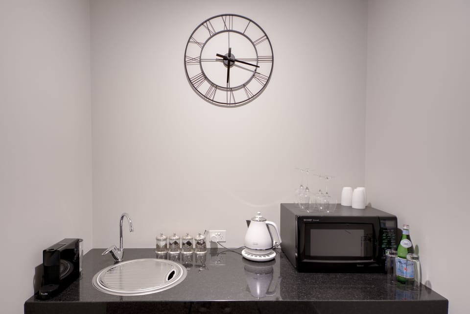 Executive Suite, 1 King Bed | Private kitchenette | Fridge, microwave, espresso maker, coffee/tea maker