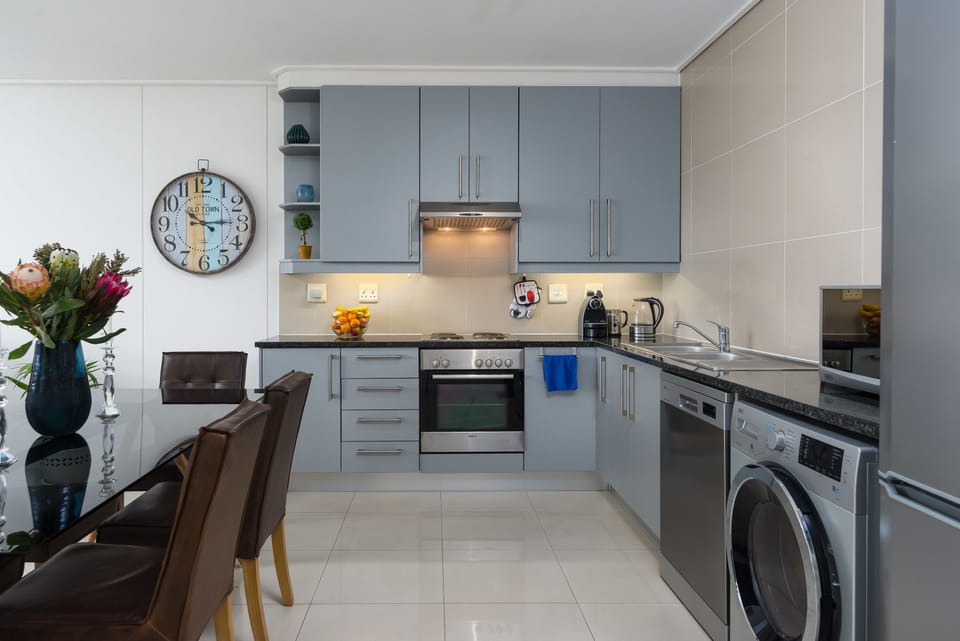 Comfort Condo, Balcony, City View | Private kitchen | Fridge, microwave, oven, stovetop