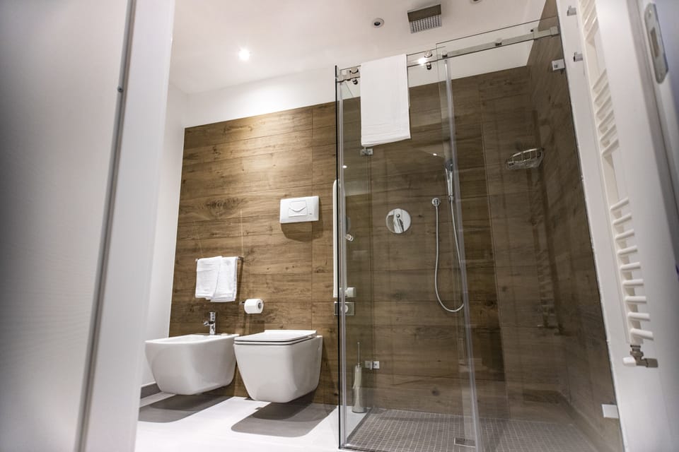 Deluxe Triple Room, Terrace | Bathroom | Shower, free toiletries, slippers, bidet