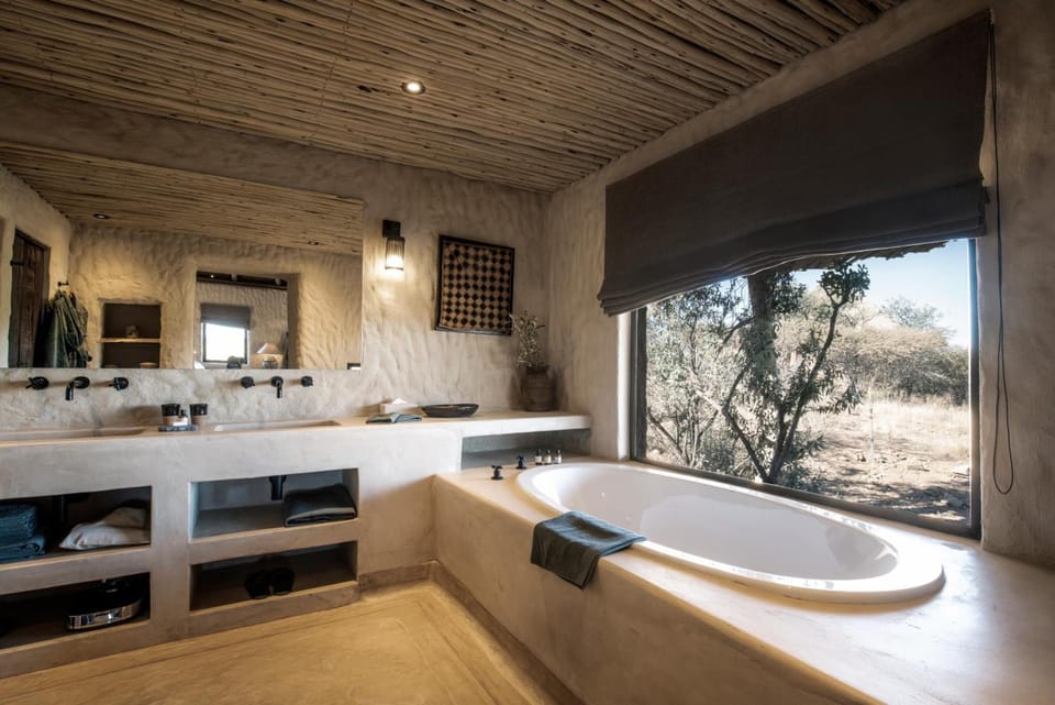 Separate tub and shower, rainfall showerhead, free toiletries