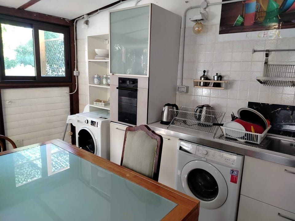 Microwave, stovetop, freezer, dining table