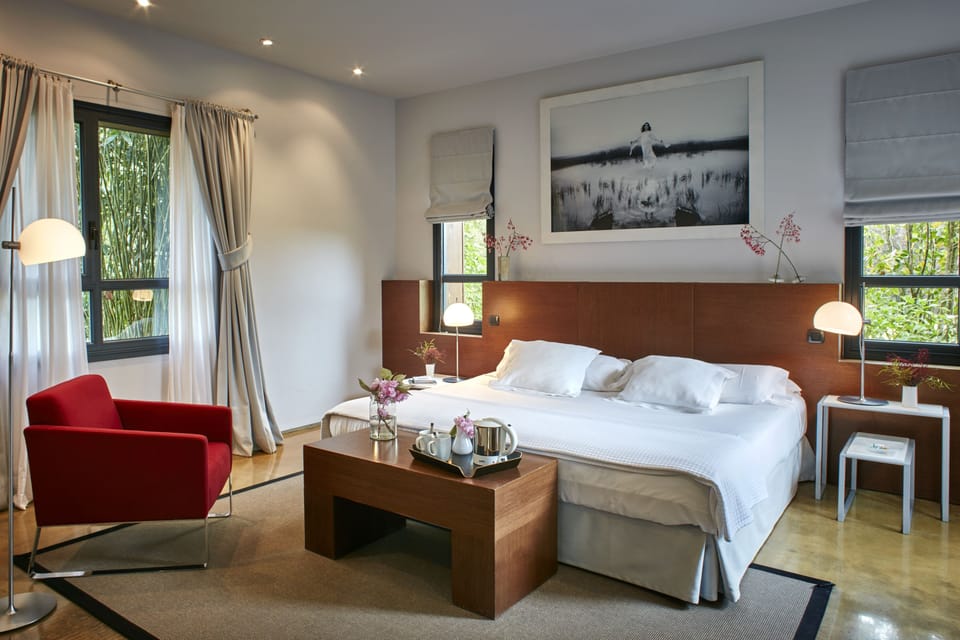 Suite, Garden Area | Premium bedding, down comforters, minibar, in-room safe