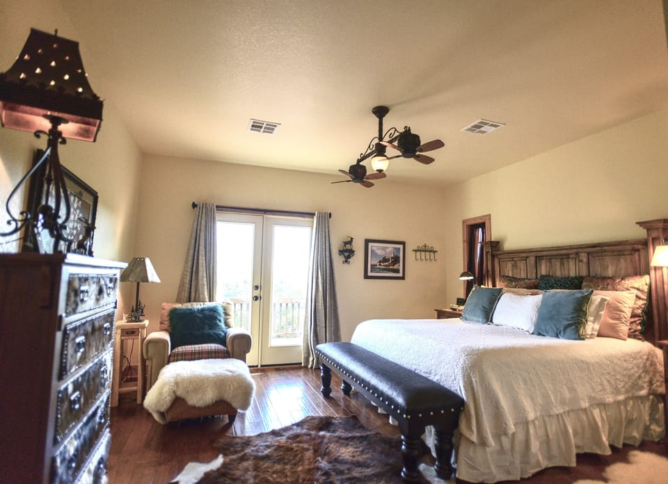Primary king bedroom with private access to upper deck