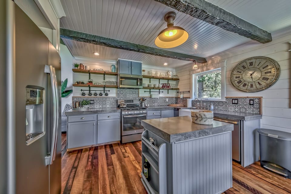 This cozy kitchen has all new appliances, gas cooktop, and natural stone counters