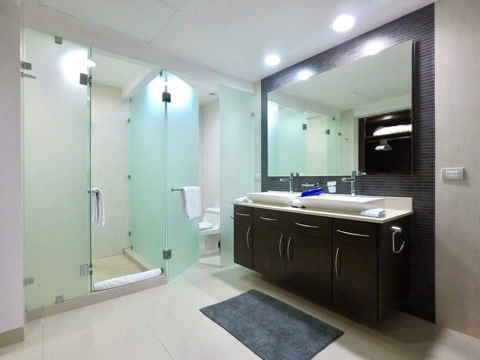 Master bath with double vessel sinks & walk in shower w/rainfall shower head