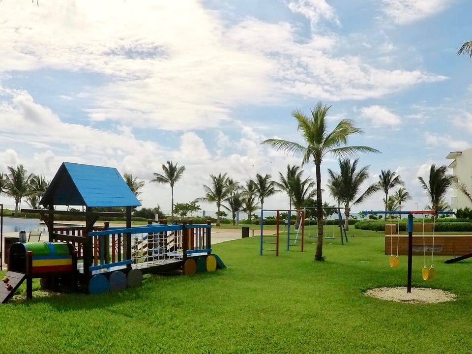 Gorgeous play areas include jumping water fountains, swings and playground