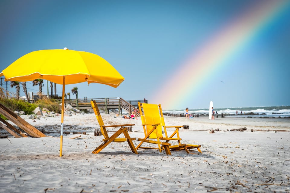 You can rent beach chairs or an umbrella. There is a local beach chair company which will set up umbrellas and chairs on the beach for you!
