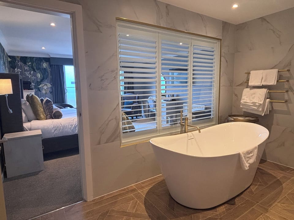 Panoramic Quadruple Room, Sea View | Bathroom | Hair dryer, towels, soap, shampoo