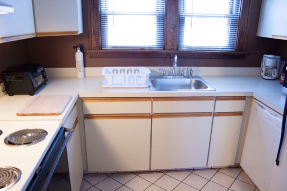 Kitchen with Oven, Stove, Microwave, Toaster, Refrigerator, Kitchen Ware
