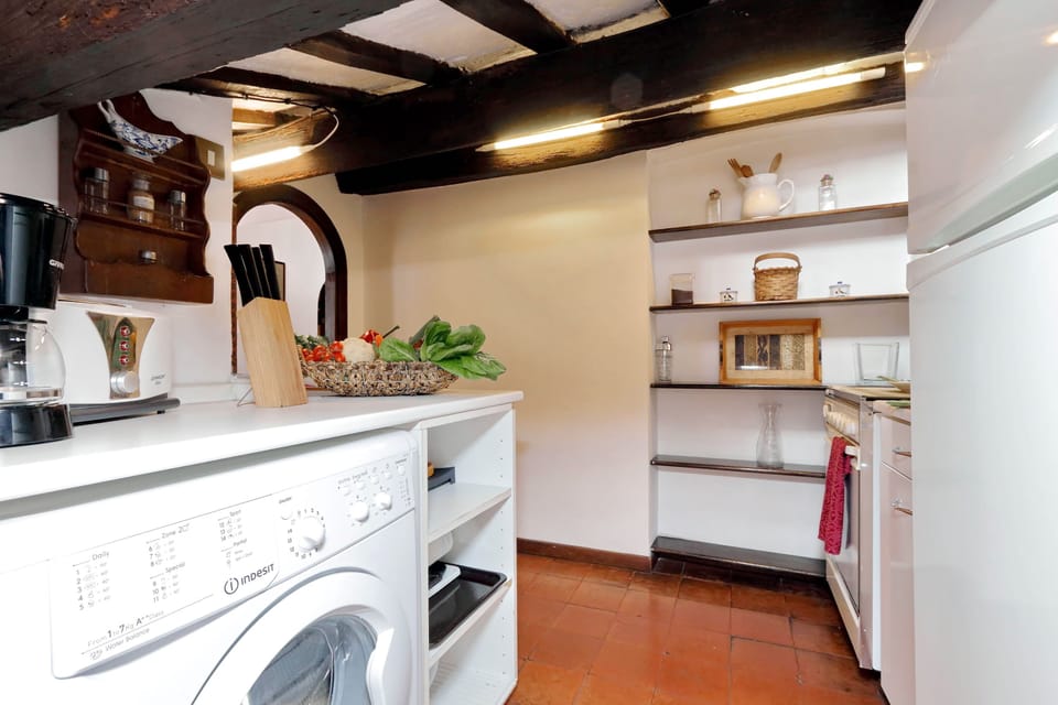 Full-size fridge, microwave, stovetop, coffee/tea maker