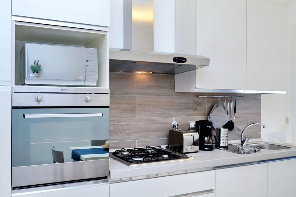 Apartment, 2 Bedrooms | Private kitchenette | Full-size fridge, microwave, oven, stovetop