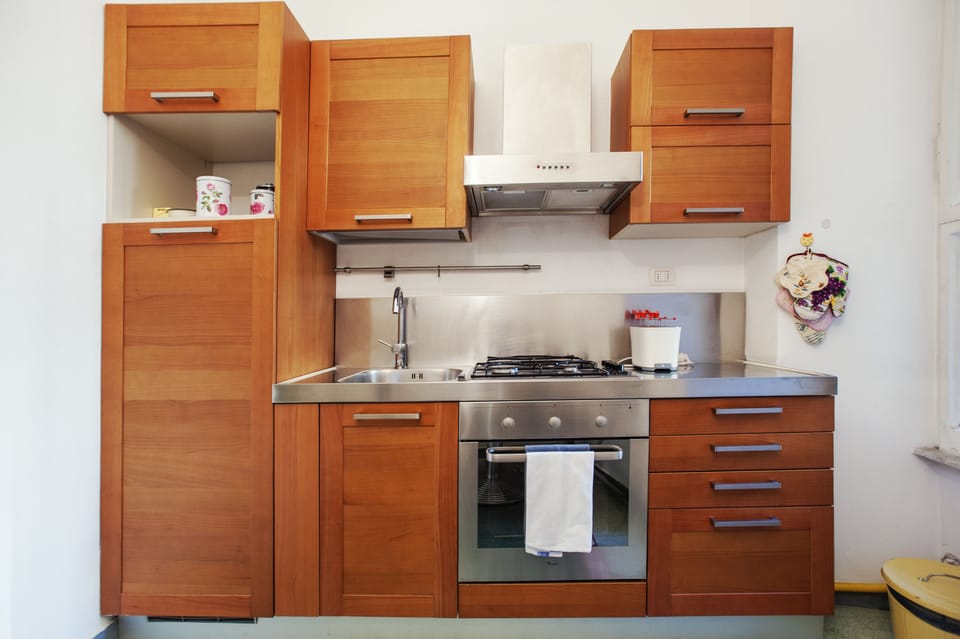 Apartment, 3 Bedrooms | Private kitchen | Full-size fridge, stovetop, electric kettle, toaster