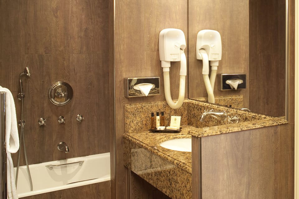 Combined shower/tub, hair dryer, bathrobes, slippers