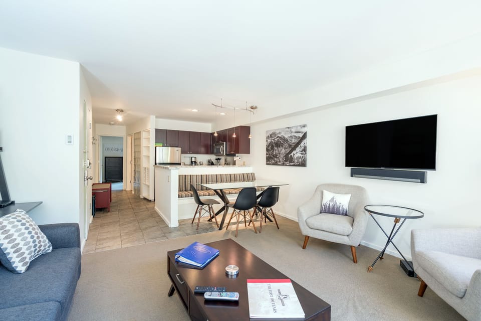 Living room with TV, couch, and coffee table.