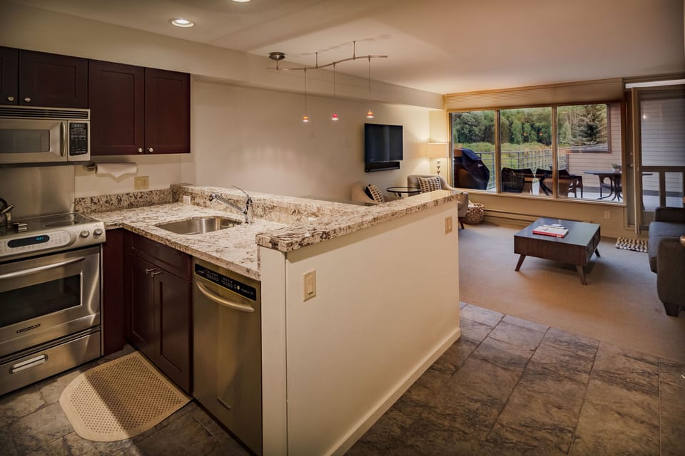 Marble counter in kitchen with sink.