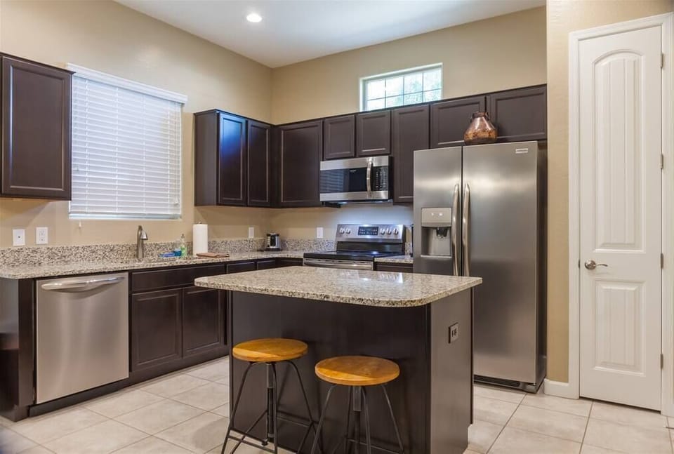 Kitchen w/ Stainless Steel appliances and Granite Countertops