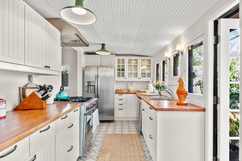 Kitchen with all you need to cook meals. 
Wolf stove.
Opens to courtyard. 