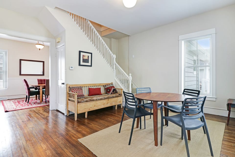 The stairs to the second floor are located in the front room.