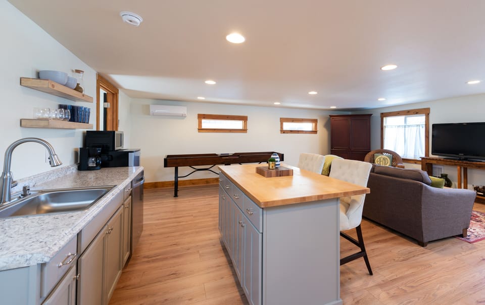 Backhouse main living area - kitchenette, living room, and SHUFFLEBOARD!