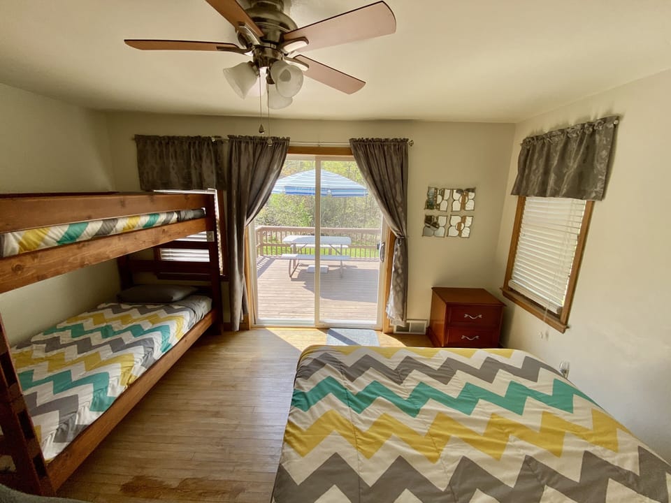Bedroom 2: 1 queen bed, 1 twin bunk bed
Closet, access to deck