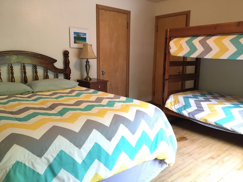Bedroom 2: 1 queen bed, 1 twin bunk bed
Closet, access to deck