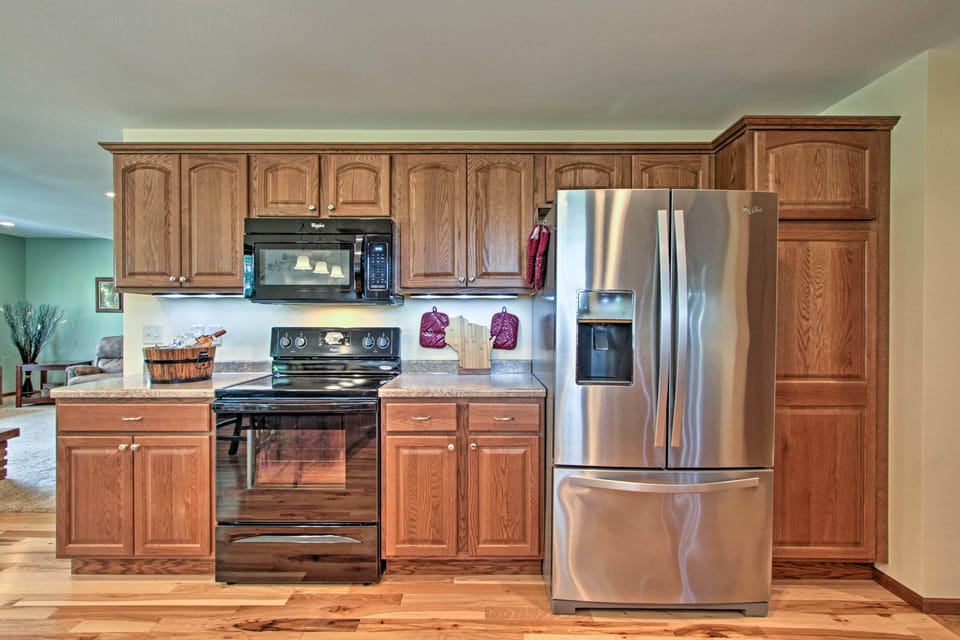 Large kitchen includes full size refrigerator with ice and water in the door. 