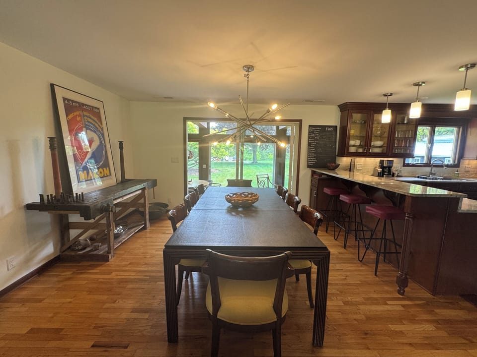 Large dining room table seats 8, plus seating for 3 at the counter