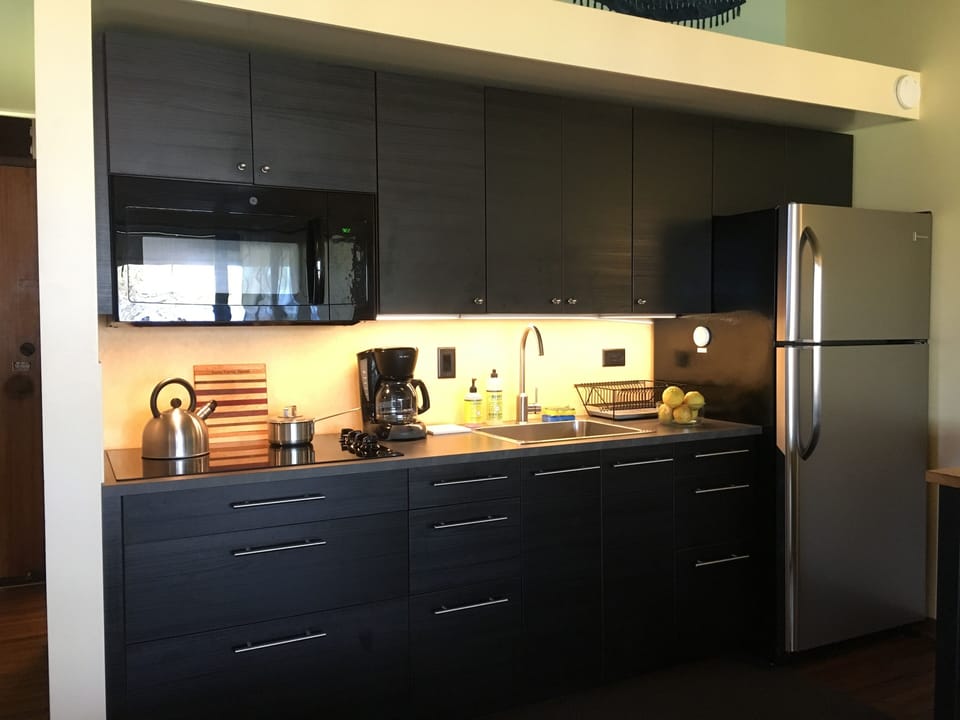 Galley kitchen with new appliances, fully outfitted