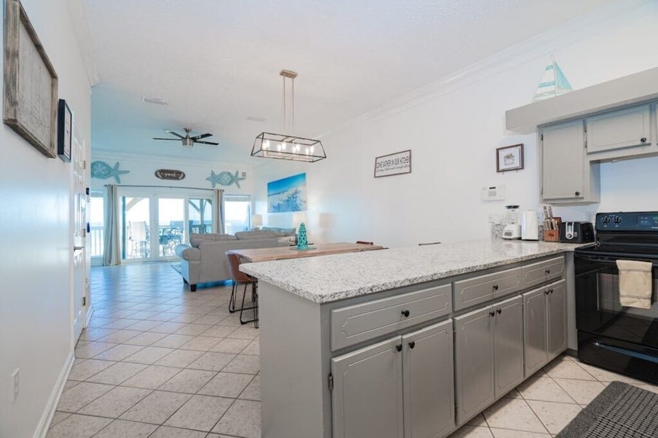 Open kitchen with dining and living area - overlooking the beach. You can see the video of the property @ JSKRentals.