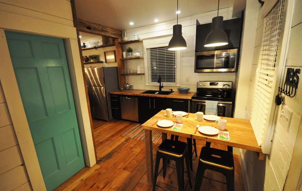Modern kitchen with rustic shelving and flooring 