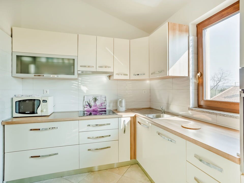 Room, Property, Furniture, Kitchen, Cabinetry, Interior Design, Countertop, Purple, Building, Drawer