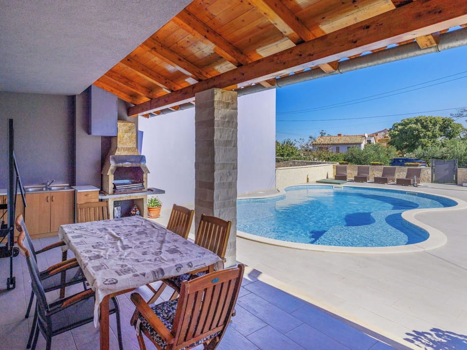 Swimming Pool, Flooring, Floor, Composite Material, Outdoor Furniture, Resort, Tile, Shade, Estate, Chair