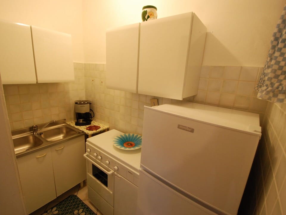 Room, Property, Furniture, Cabinetry, Floor, Interior Design, Major Appliance, Sink, Countertop, Kitchen