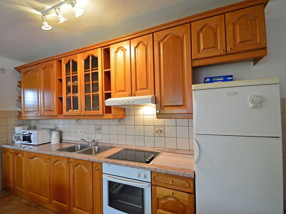 Cabinetry, Countertop, Kitchen, Room, Property, Furniture, Major Appliance, Wood Stain, Floor, Cupboard