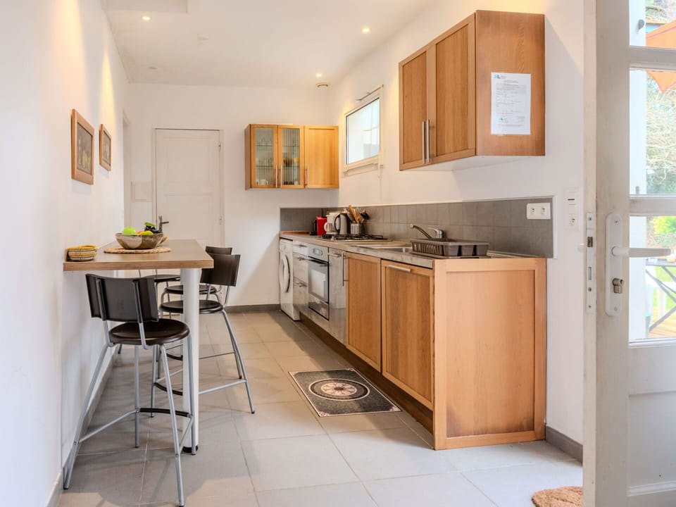 Furniture, Kitchen Appliance, Countertop, Kitchen, Flooring, Interior Design, Cabinetry, Major Appliance, Wood, Floor