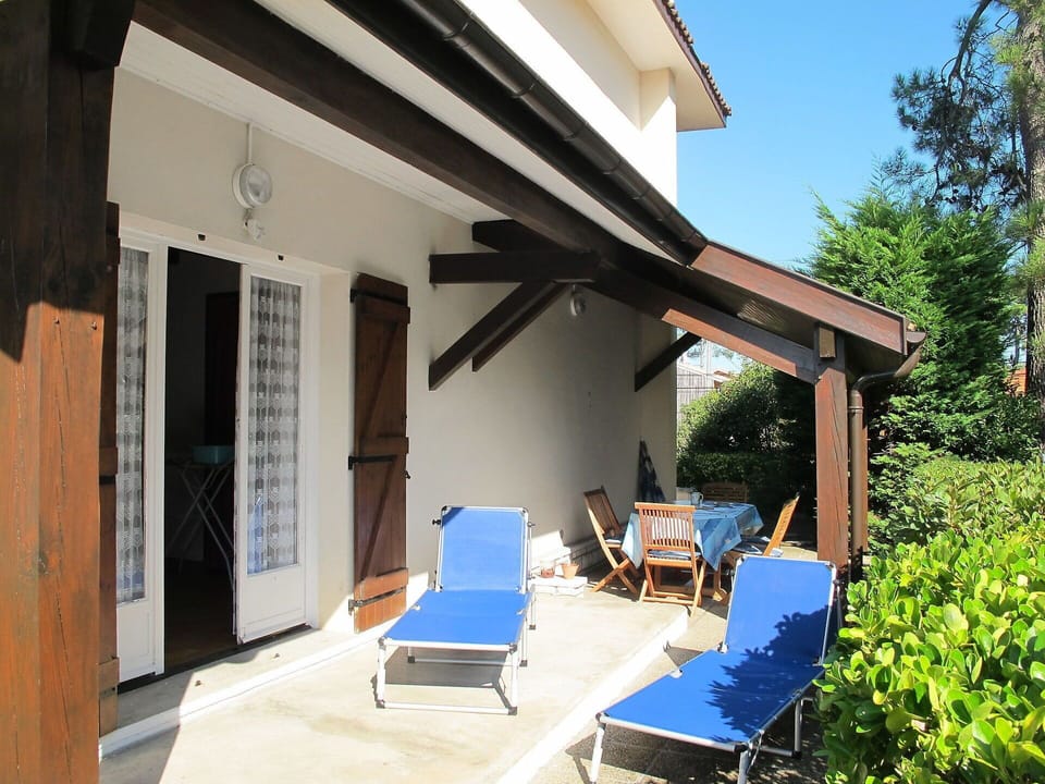 Plant, Property, Building, Shade, Chair, Sky, Outdoor Furniture, Cottage, Tree, Door