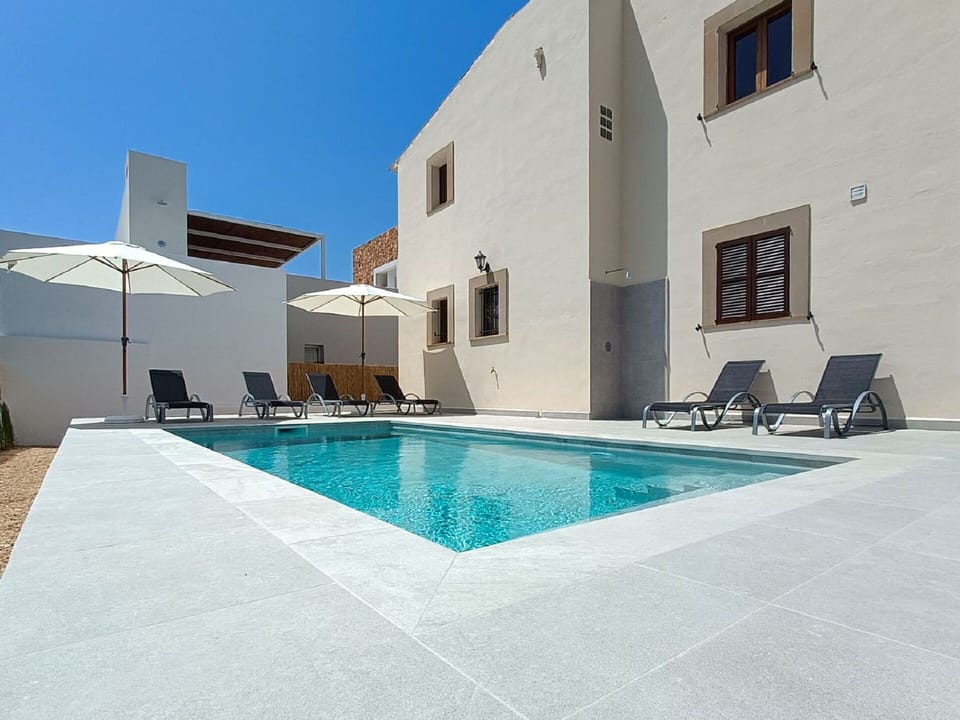 Sky, Property, Building, Water, Azure, Swimming Pool, Window, Shade, Rectangle, Outdoor Furniture