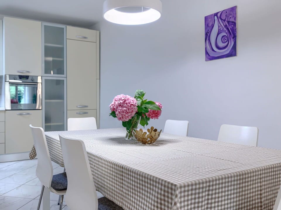 Furniture, Interior Design, Flooring, Table, Chair, Kitchen & Dining Room Table, Light Fixture, Lighting, Floor, Dining Room