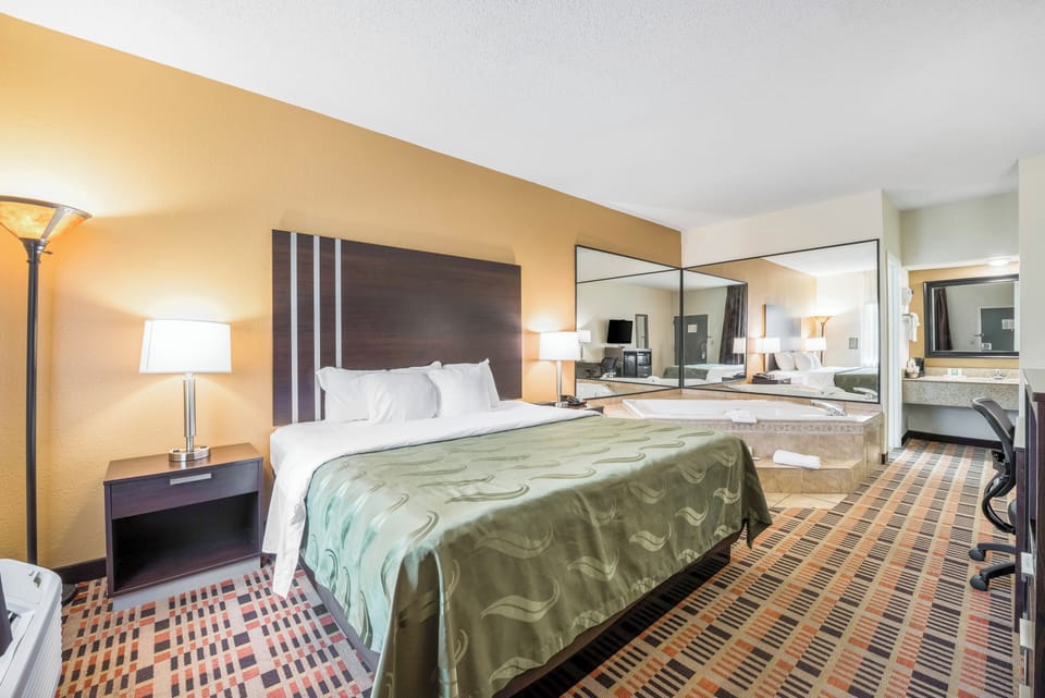 Suite, 1 King Bed, Non Smoking | In-room safe, desk, laptop workspace, iron/ironing board